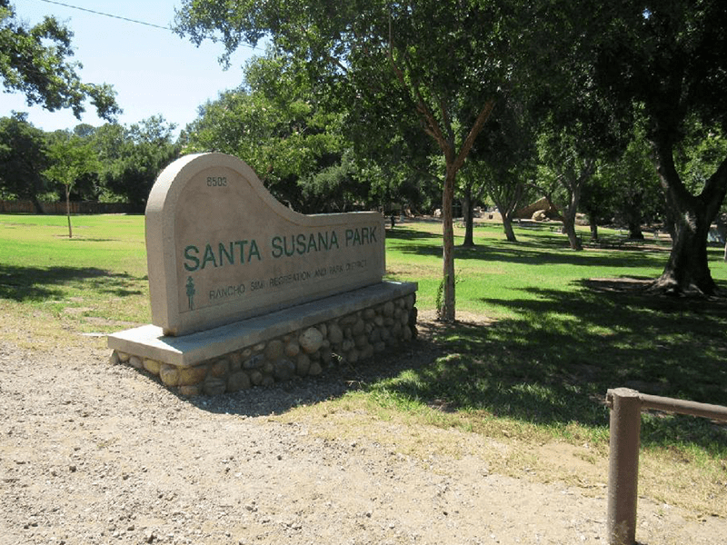 Santa Susana Park sign with grass and trees behind it