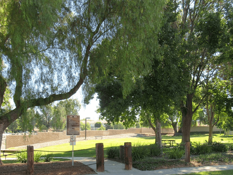 Willowbrook park grass field, trees, and paved path