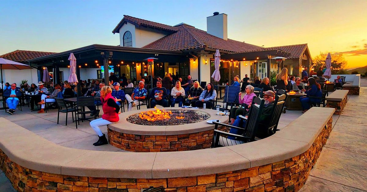 People enjoying an evening at the outdoor patio space at Tierra Rejada Golf Club in Simi Valley, CA