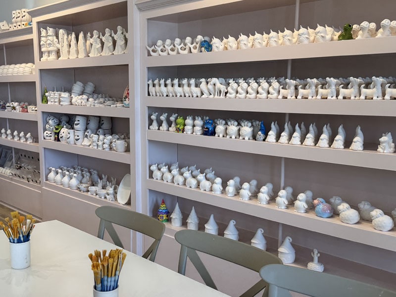 Colorful handcrafted ceramic figurines display at Visit Simi Valley art studio.