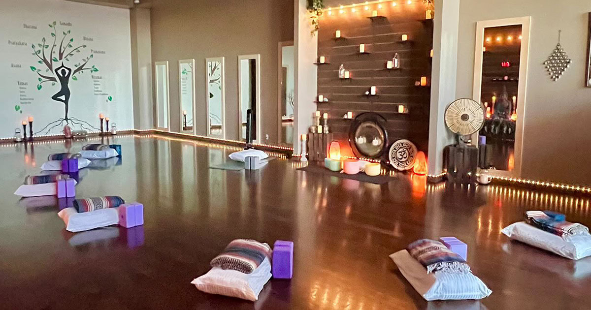 Relaxing yoga or meditation space with candles and cushions in Simi Valley wellness center.