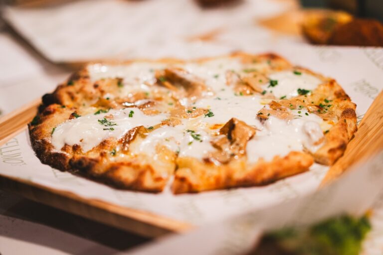 Delicious Margherita pizza with fresh mozzarella, basil, and tomato sauce at Porcellino's, Simi Vall.
