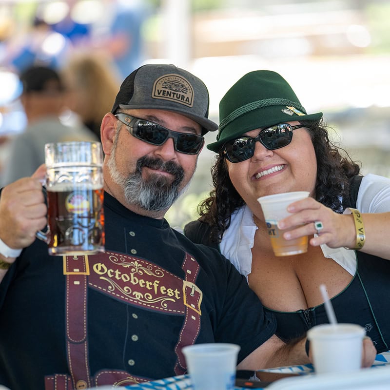 Happy couple enjoying beer at Simi Valley Oktoberfest event.